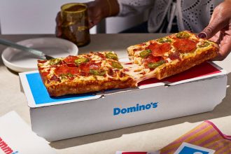 Domino's The Domino. A pizza finally shaped like the logo after 65 years