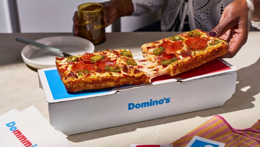 Domino's The Domino. A pizza finally shaped like the logo after 65 years